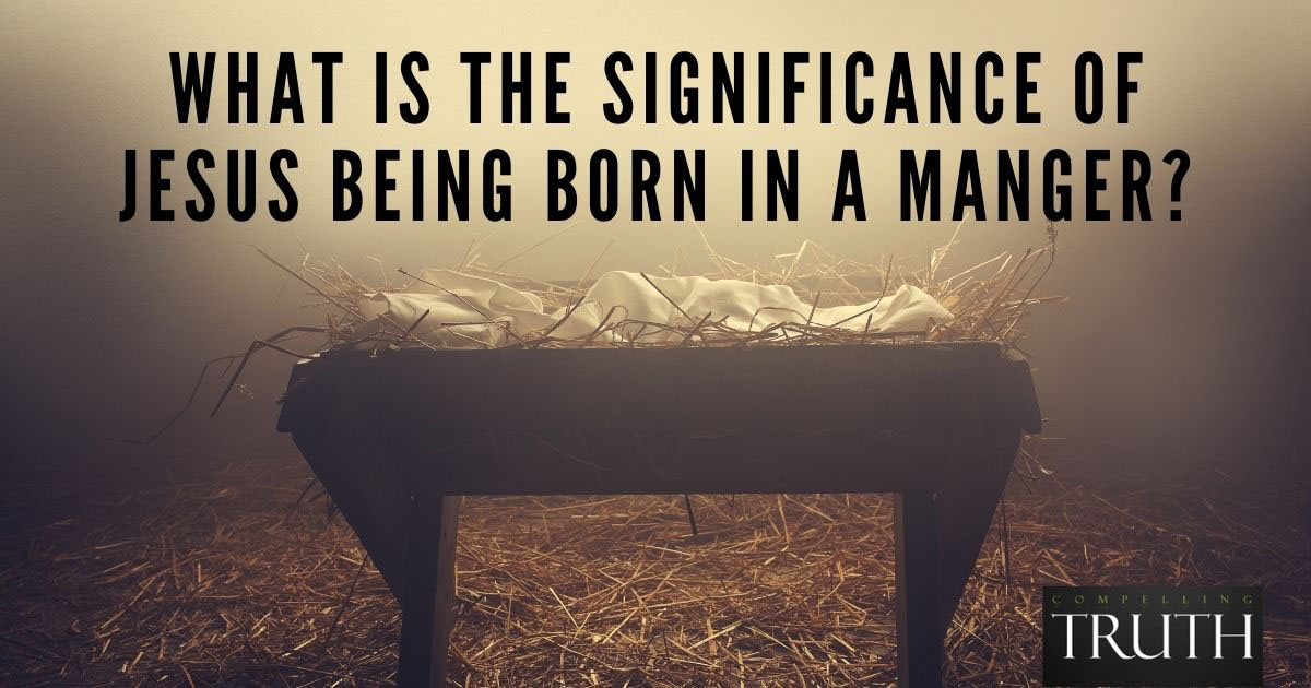 What is the significance of Jesus being born in a manger?